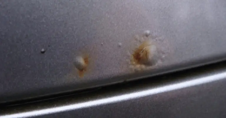 here's an example of rust bubbles in a silver car's paint job