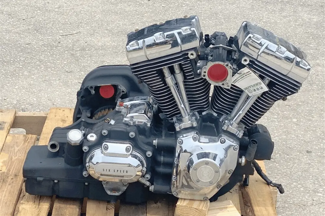 harley davidson's 96ci twin cam motor sitting on a wooden pallet