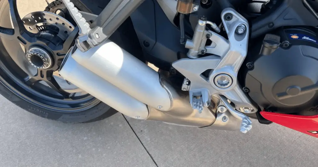 Here, you can see the right foot peg and brake lever were snapped completely off. This occurred in a low-speed roundabout.