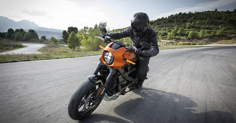 Photo of Orange Harley Davidson Livewire Driving Down The Right, Shifting Automatically.