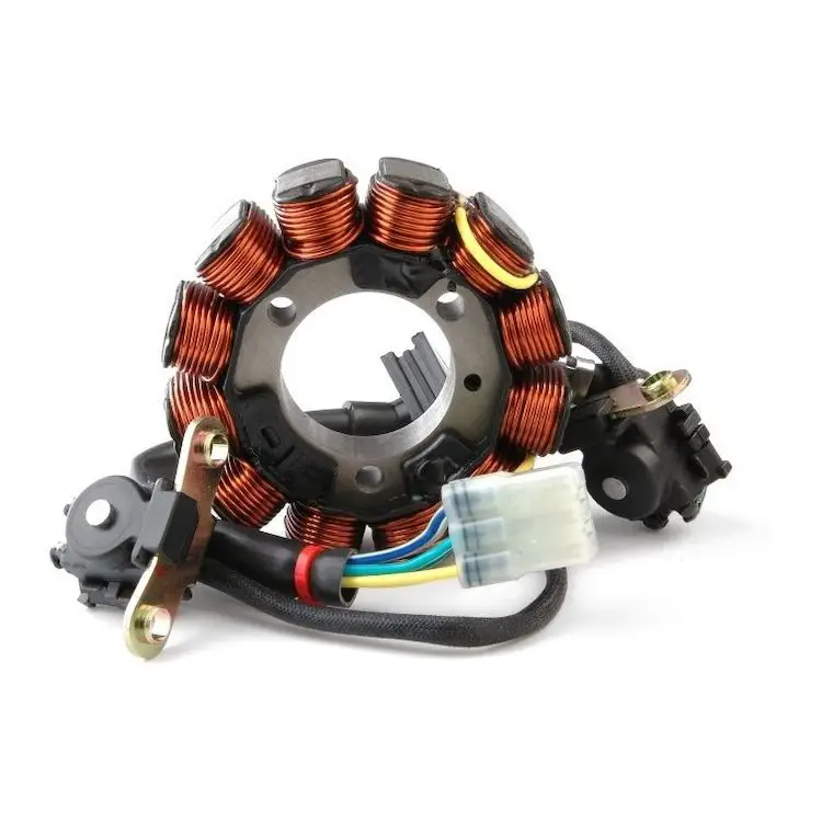 This is a picture of a motorcycle stator, specifically used to visualize the output wires that will be tested with a multimeter.