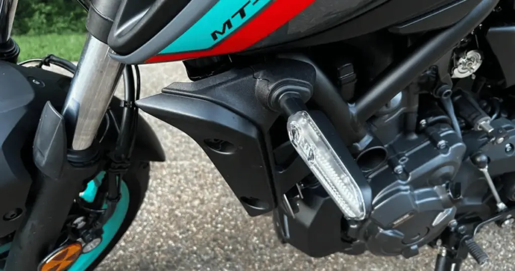 This is an example of a broken indicator light, after the motorcycle was dropped at a standstill.