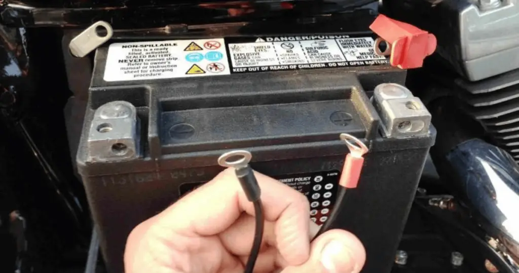 This is a picture of a Harley's battery being disconnected to reset the radio display.
