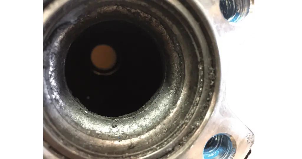 The same bearing, but removed to show the dirt and contaminants that caused it to fail
