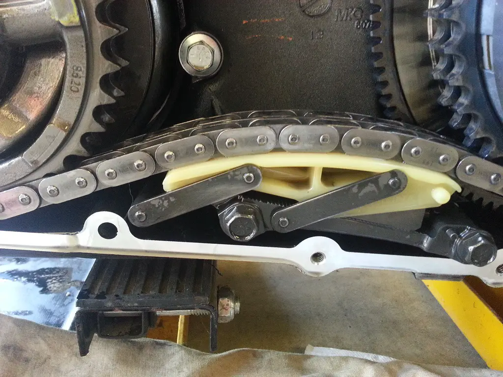Example of a new automatic primary chain tensioner that's installed inside the primary case of a Harley Davidson
