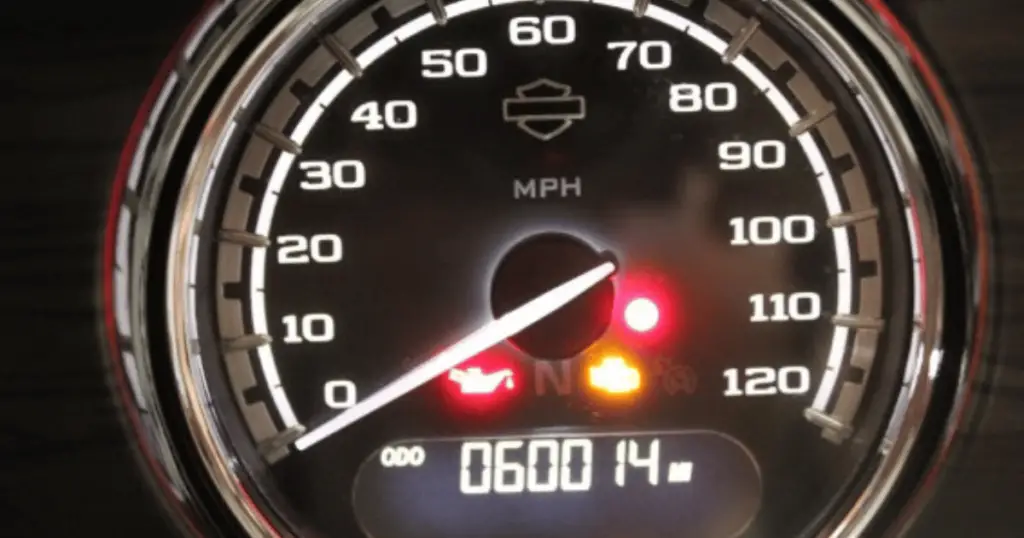 Example of an illuminated red light on a Harley's speedometer