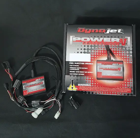 Box of a Power Commander 5 with the Power Commander unit and harness shown outside